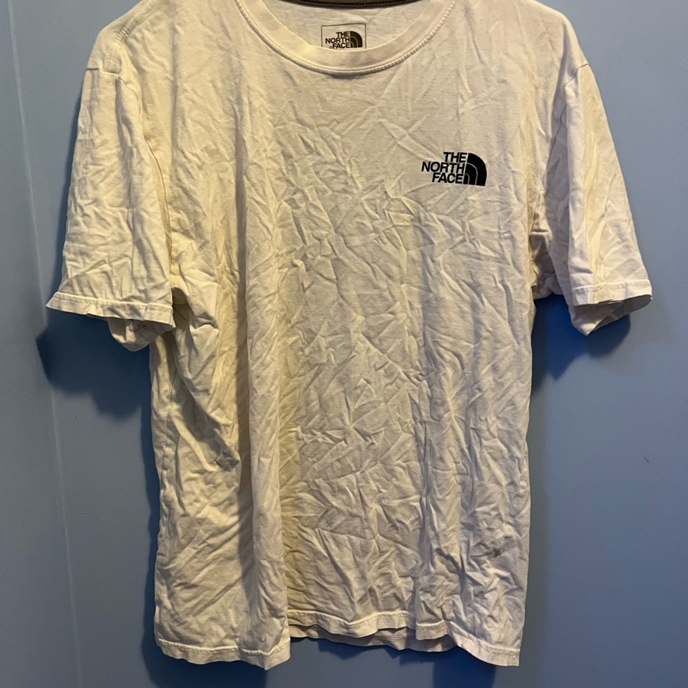 North Face short sleeve t shirt. White with a camo back.
